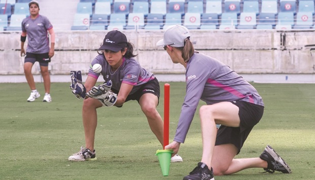 Warriors Yasmin Daswani catches the ball during a training session ahead of the SDG Fairbreak Invitational 2022 womenu2019s cricket at the Dubai Cricket Stadium. (AFP)