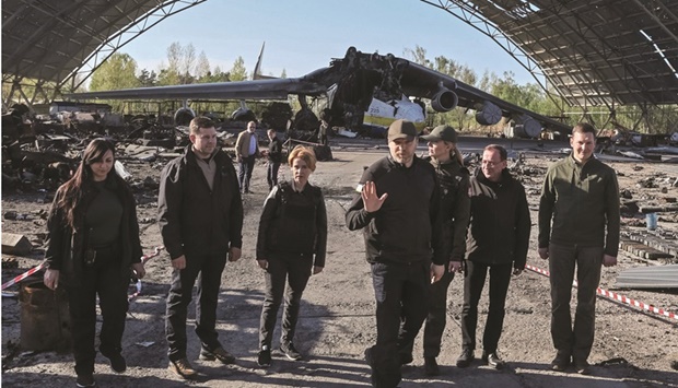 Interior ministers Denys Monastyrsky (Ukraine), Mariusz Kaminski (Poland), Kristian Jaani (Estonia), Agne Bilotaite (Lithuania) and Marija Golubeva (Latvia) are seen yesterday in front of an Antonov An-225 Mriya cargo plane, the worldu2019s biggest aircraft, destroyed by Russian troops, at an airfield in the town of Hostomel, in Kyiv region.