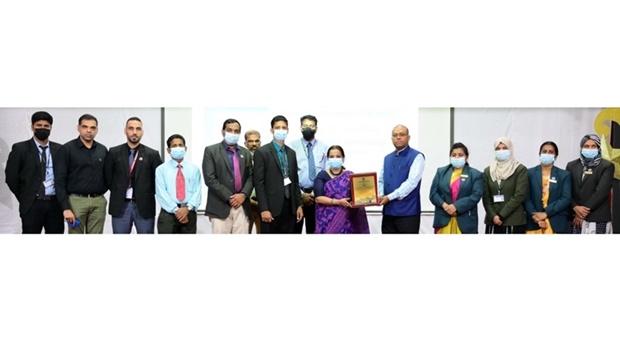 Rauf Kondotty receives a memento from principal Hameeda Kadar.