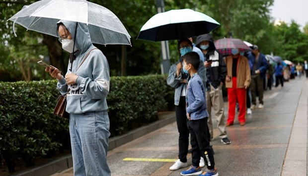 People line up to get tested at a mobile nucleic acid testing site, amid the Covid-19 outbreak in Beijing, China May 6, 2022.