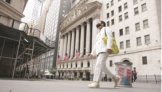 A pedestrian passes in front of the New York Stock Exchange. US stocksu2019 tumble this year is putting an increased focus on equity valuations, as investors assess whether recently discounted shares are worth buying in the face of a hawkish Federal Reserve and widespread geopolitical uncertainty.