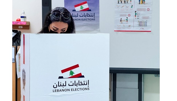 A Lebanese expatriate casts her vote in Doha.