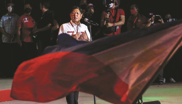 Philippine presidential candidate Ferdinand Marcos Jr greets his supporters during the last day of campaign rally at Paranaque City, suburban Manila, yesterday.