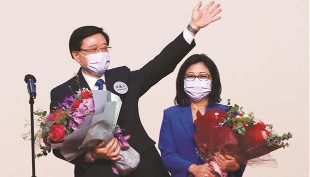 John Lee celebrates with his wife Janet Lam Lai-sim on stage after being elected as Hong Kongu2019s Chief Executive, in Hong Kong, China, yesterday.
