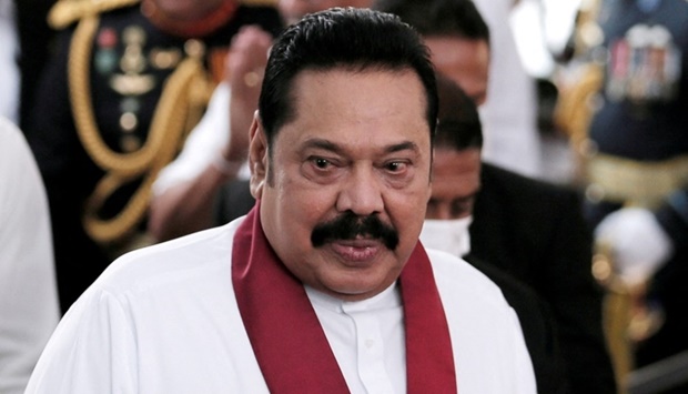Sri Lanka's Prime Minister Mahinda Rajapaksa reacts during his swearing in ceremony as the new Prime Minister, at Kelaniya Buddhist temple in Colombo, Sri Lanka, August 9, 2020. REUTERS