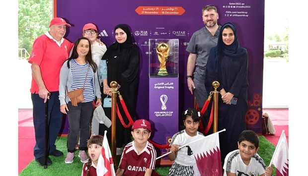 People pose with FIFA World Cup Trophy at QU Monday