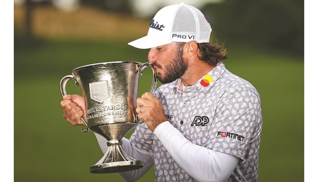 American Max Homa kisses the Trophy after winning the Wells Fargo Championship in Potomac, Maryland, USA, on Sunday. (USA TODAY Sports)