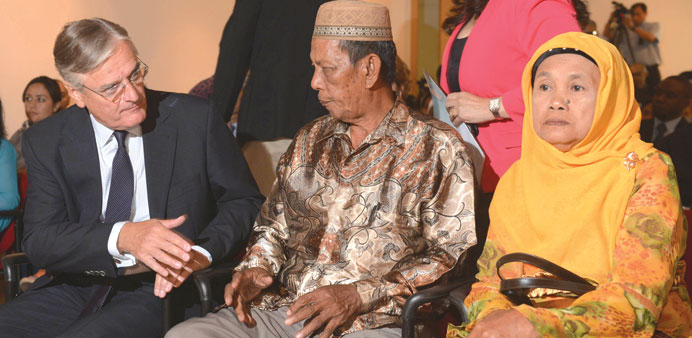 Dutch Ambassador Tjeerd de Zwaan greets Ambo Upe and Aisyah, (R) Indonesian relatives of victims of summary executions by the Dutch army in Indonesia.