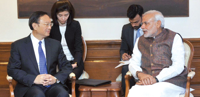 Chinese Special Representative Yang Jiechi speaks with Prime Minister Narendra Modi during a meeting in New Delhi yesterday.