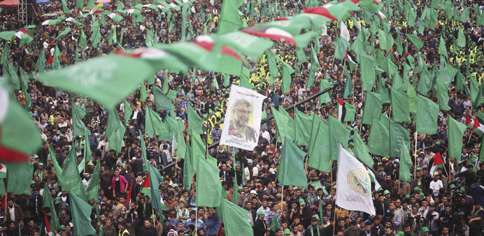Palestinian Hamas supporters take part in a rally marking the anniversary of the death of its leaders killed by Israel, in Gaza City yesterday.