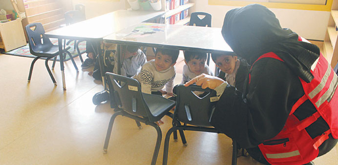 KG students get practical training on how to deal with earthquakes.