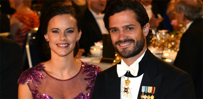 Prince Carl Philip of Sweden (R) and his fiancee Sofia Hellqvist