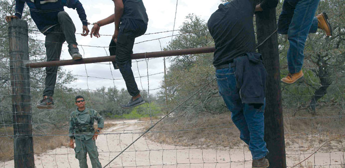 Men are taken into custody by the US Border Patrol near Falfurrias, Texas in this file photo taken on March 29.
