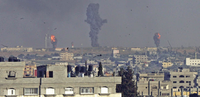 Smoke and flames are seen following  Israeli air strikes in Rafah in the southern Gaza Strip yesterday.