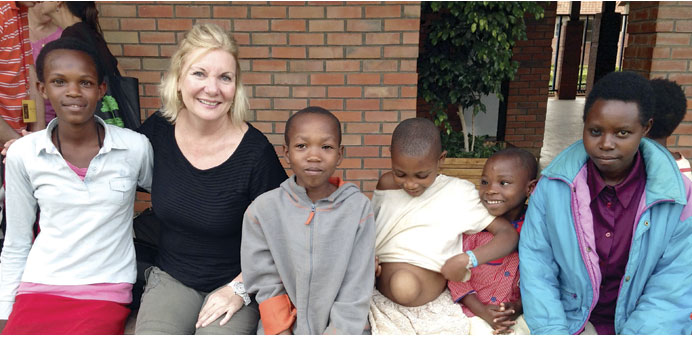 * Tracy Glenn is seen with a group of community members who turned up at Kibagabaga Hospital from all over Rwanda.