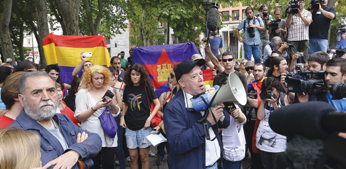 Demonstrators protest against the monarchy near the Spainu2019s lower house of parliament in Madrid as Spainu2019s deputies voted on the bill allowing the abd