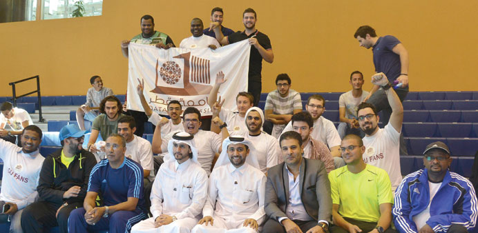QU president Dr Hassan al-Derham with the winning team.