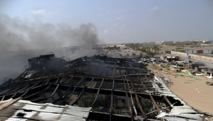  Smoke rises from a milk factory hit by an air strike in Yemen's western port city of Houdieda REUTERS
