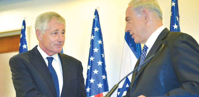 Netanyahu shakes hands with Hagel while delivering remarks at the Prime Ministeru2019s Office in Jerusalem yesterday.