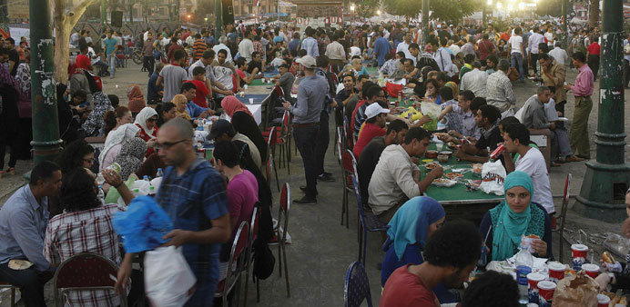  Families gather for a mass Iftar at Tahrir square in Cairo.