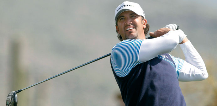   Scott Piercy of the U.S. watches his tee shot on the 11th hole during the second round of the WGC-Accenture Match Play Championship golf tournament 