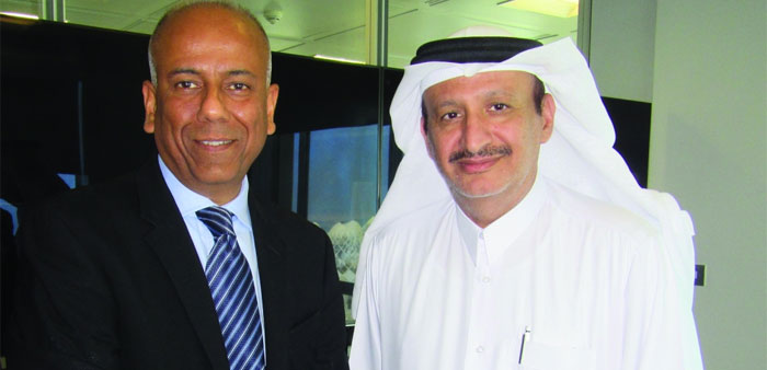 Chowdhary with al-Derbesti after concluding the 5-year contract in Doha for advanced mobile broadband network.