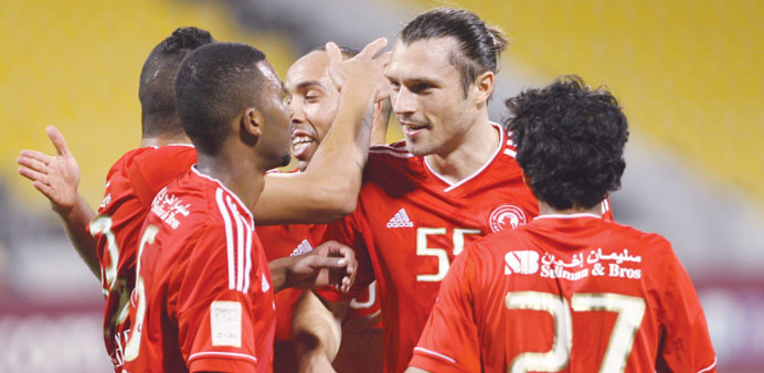 Al Arabi players celebrate after winning their QNB Cup semi-final against Al Gharafa yesterday. 