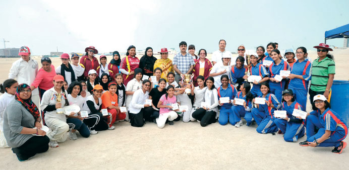 Players and QCA officials pose after Birla Public School won the  QCA under-17 girls cricket tournament.