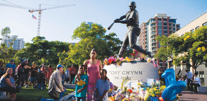 Fans mourn at a makeshift memorial to former San Diego Padres outfielder Tony Gwynn at Petco Park in San Diego, California on Monday. (Reuters)