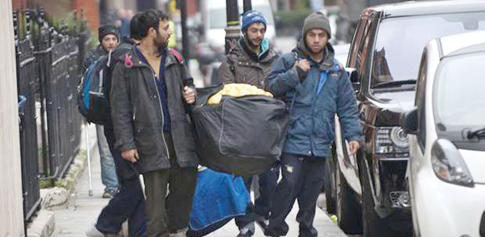 Marble Arch migrants: immigrants gather after a night sleeping on the streets.