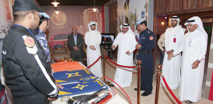 HE the Transport Minister Jassim Seif Ahmed al-Sulaiti and others at one of the pavilions at the exhibition.