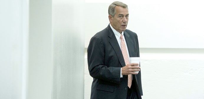 Speaker of the House Republican John Boehner walks to a Republican conference meeting, on Capitol Hill in Washington DC, yesterday.