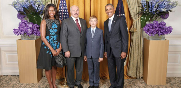 Belarusu2019 President Alexander Lukashenko and his son Nikolay pose for a photo with US President Barack Obama and US First Lady Michelle Obama at the UN