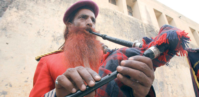 Sanaullah Haq, who is serving a life term, plays a bagpipe during a routine practice inside Kotbhalwal central jail in Jammu in this May 20, 2011 file