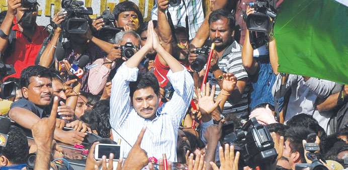 YSR Congress chief Jagan Mohan Reddy greets party supporters after being released on bail from Chanchalguda Central Prison in Hyderabad yesterday.