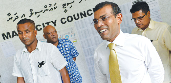 Former Maldivian president and presidential candidate Mohamed Nasheed, second right, leaves after a press conference in Male yesterday.