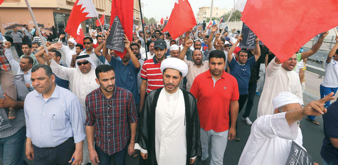 Sheikh Ali Salman (centre) marches during the rally in Bilad Al-Qadim yesterday.