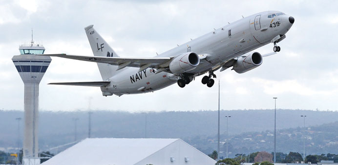 A US Navy P-8 Poseidon aircraft takes off from Perth International Airport to participate in the continuing search in the southern Indian Ocean for th