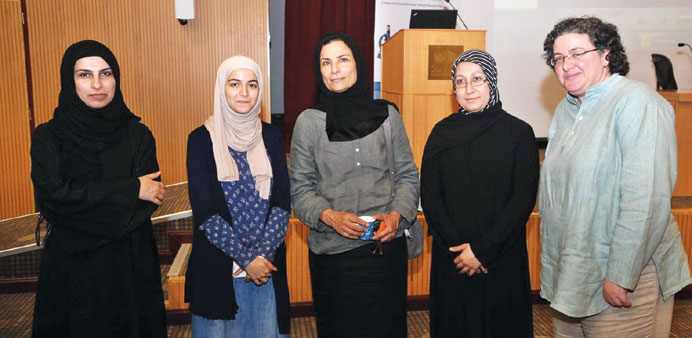Prof al- Misnad along with some QU faculty and students. 