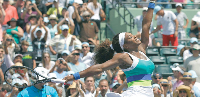 Serena Williams celebrates her win over Maria Sharapova (below) in their womenu2019s singles final match at the WTA Miami tennis tournament on Saturday. (
