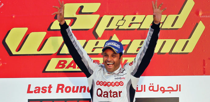 Qataru2019s Nasser al-Attiyah celebrates after finishing third overall at the Porsche GT3 Cup Challenge Middle East yesterday.