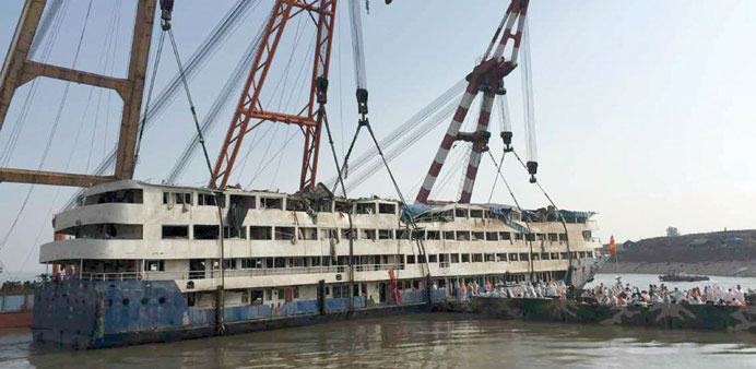 Rescue workers enter the salvaged cruise ship Eastern Star on the Yangtze yesterday.
