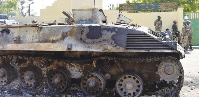 A Boko Haram tank destroyed by Cameroonian soldiers stands in front of a military base in Amchide in northern Cameroon.