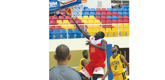 Al Arabiu2019s Hassino Ndoye attempts  to score against Qatar Sports Club during their league match at the Gharafa Indoor Hall yesterday.