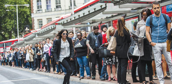  A woman skateboards to work during the Tube strike. 