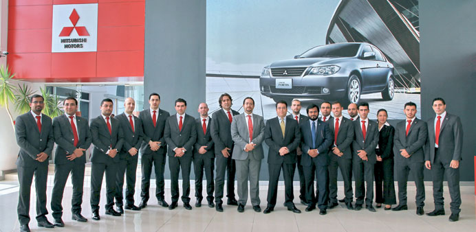 Mitsubishi and Qatar Automobiles Company officials at the award ceremony.