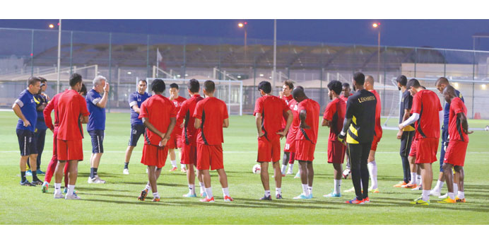 Lekhwiya coach Eric Gerets (left) addresses the team during a training session.