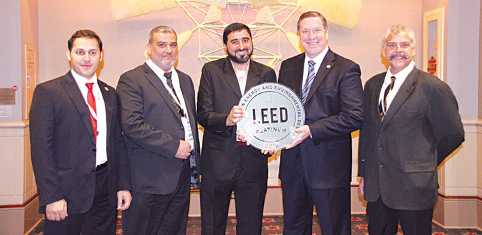 Telefat (centre) receiving the award from Fedrizzi yesterday at the Greenbuild 2013 International Conference and Expo in Philadelphia, US.
