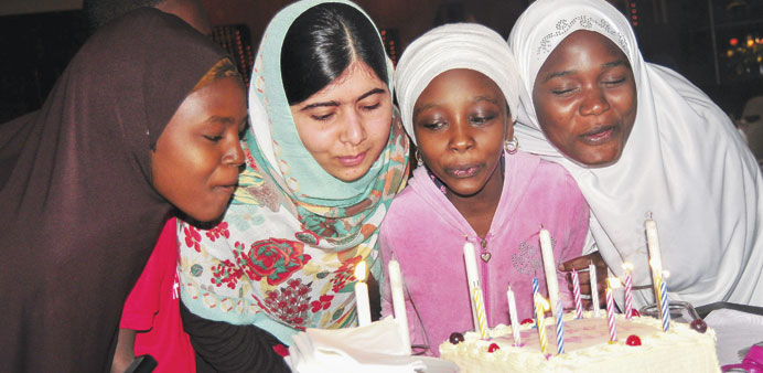 Malala Yousafzai with Nigerians from the u2018Bring back our girlsu2019 campaign during a dinner in Abuja.