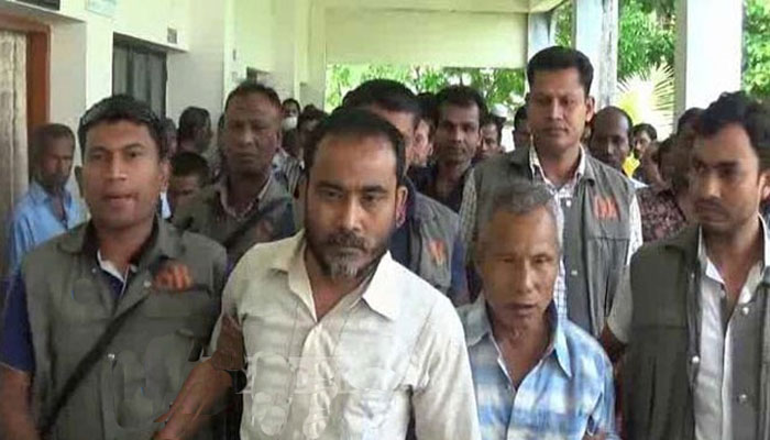 Indian separatist outfit ULFAu2019s leader Ranjan Chowdhury and his associate Pradi Marak arrives at the court. Picture courtesy : bdnews24.com